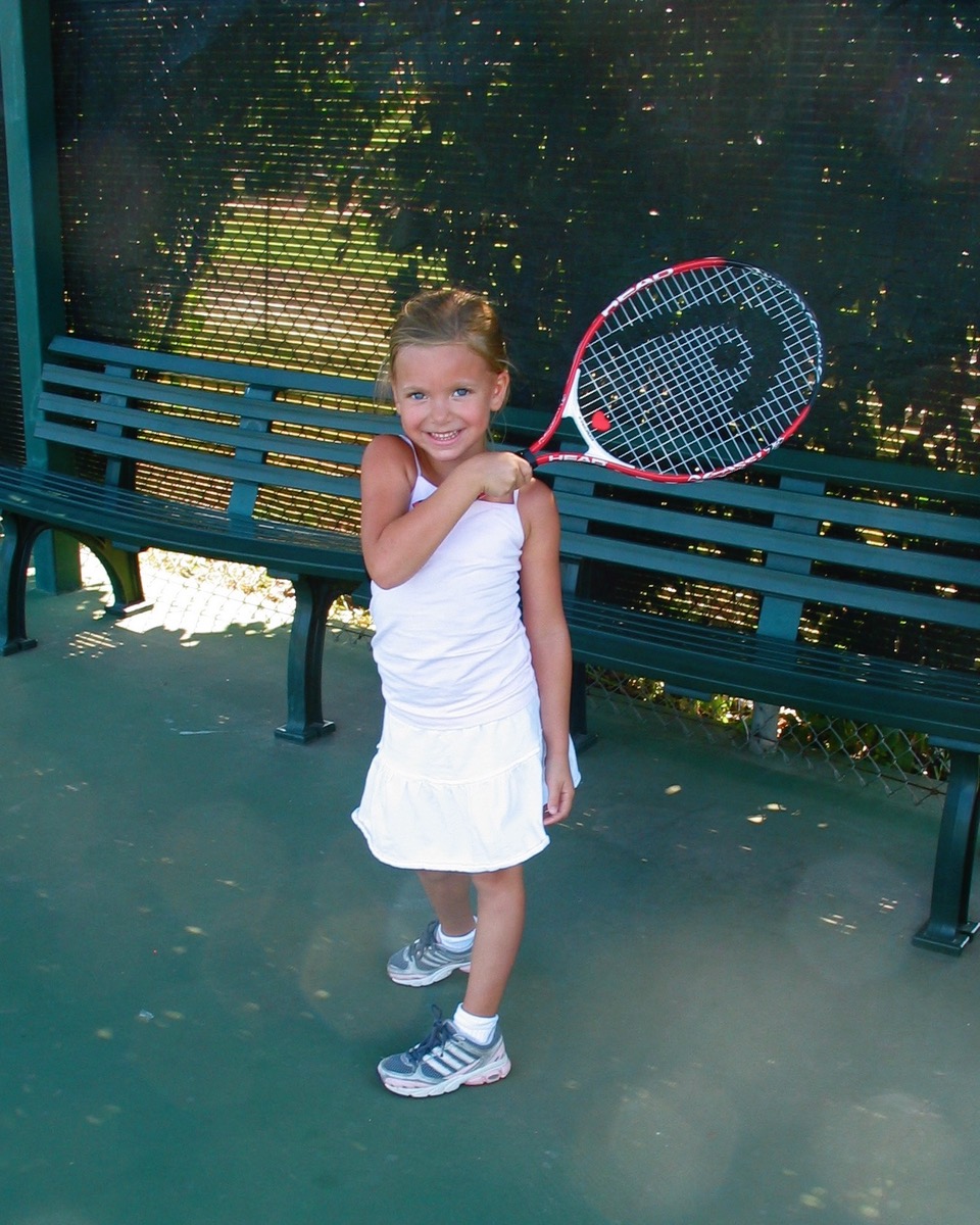 Lindsey playing tennis as a child